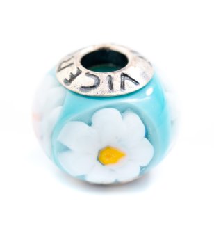 Талисман в светлосиньо с цветя снимка